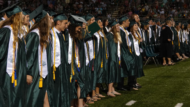 Students attend the Santa Fe High School graduation ceremony Friday