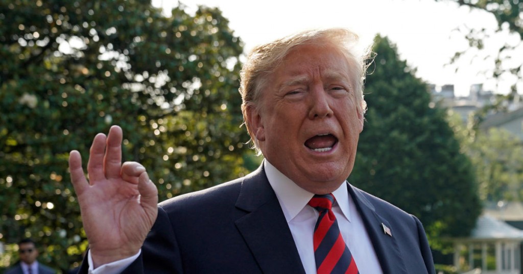 U.S. President Donald Trump speaks as he departs the White House in Washington