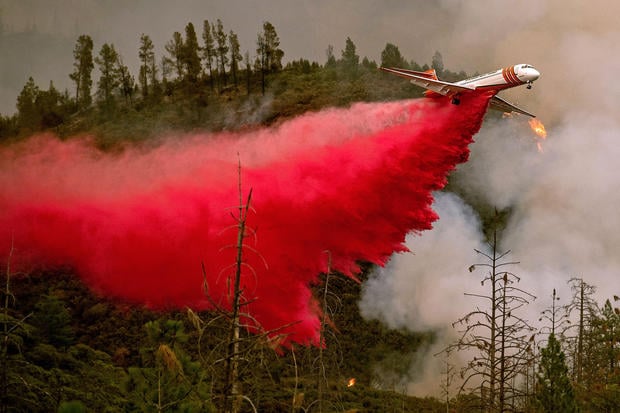 TOPSHOT - An air tanker drops retardant while battling the Ferguson fire in Stanislaus National Forest