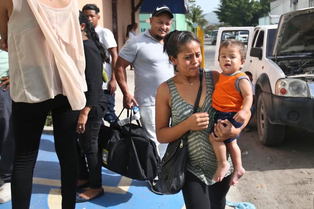 Adalicia Montecino holds her year-old son Johan Bueso Montecinos