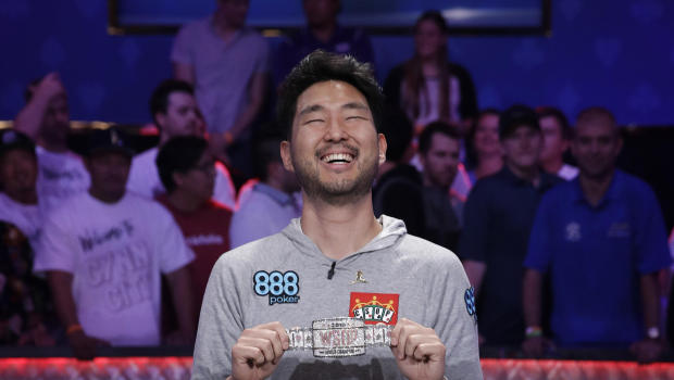 John Cynn smiles as he poses after winning the World Series of Poker main event