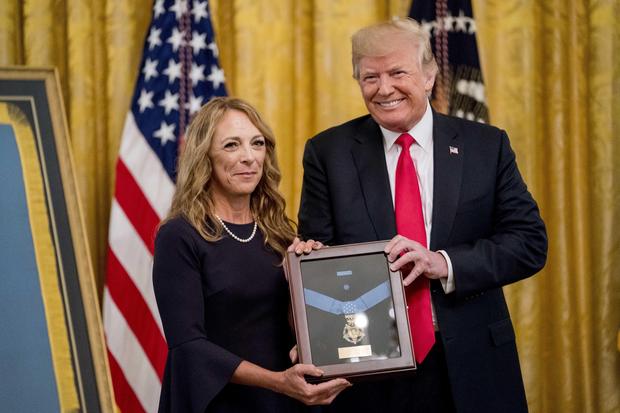 Valerie Nessel accepts the Medal of Honor from President Donald Trump for her husband Air Force Tech. Sgt. John A. Chapman
