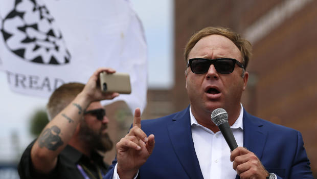 Alex Jones from Infowars.com speaks during a rally in support of Republican presidential candidate Donald Trump near the Republican National Convention in Cleveland