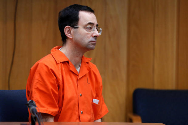 Larry Nassar, a former USA Gymnastics team doctor who pleaded guilty in November 2017 to sexual assault charges, listens to Judge Janice Cunningham during his sentencing hearing in the Eaton County Court in Charlotte, Michigan, Feb. 5, 2018. 