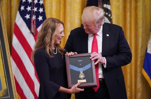 US President Donald Trump presents Valerie Nessel