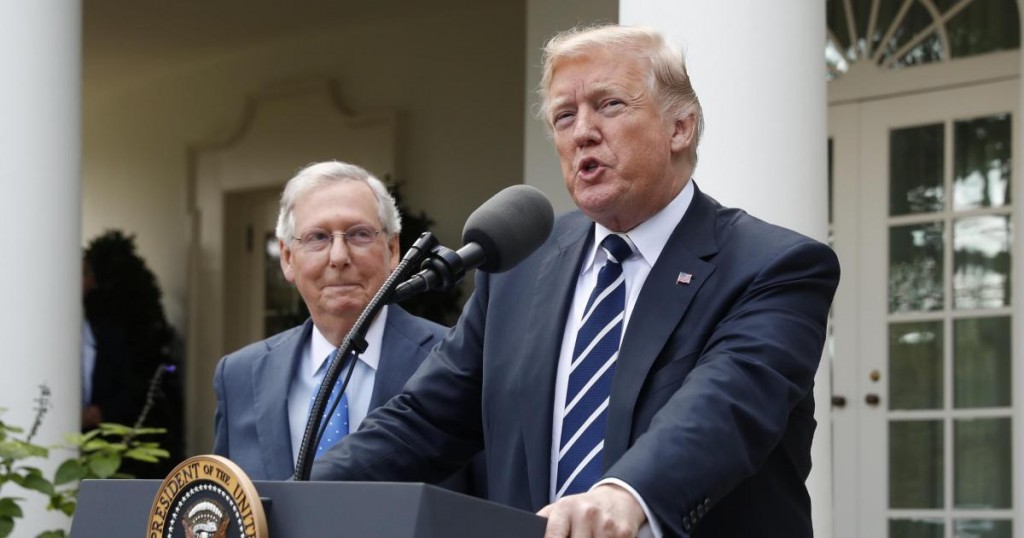 U.S. President Donald Trump speaks to the media with U.S. Senate Majority Leader Mitch McConnell at his side in the Rose Garden of the White House in Washington