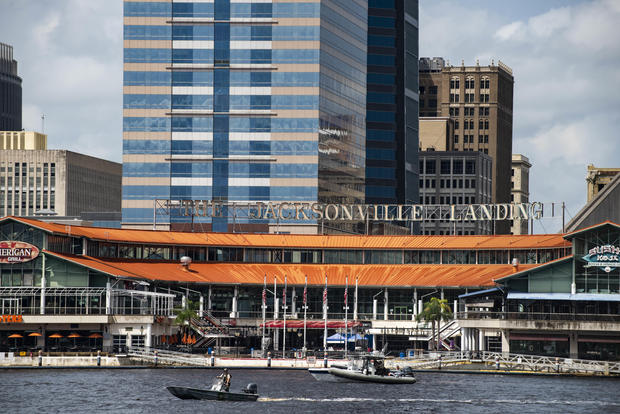 The coast guard patrols the St John's river outside of the Jacksonville Landing in Jacksonville