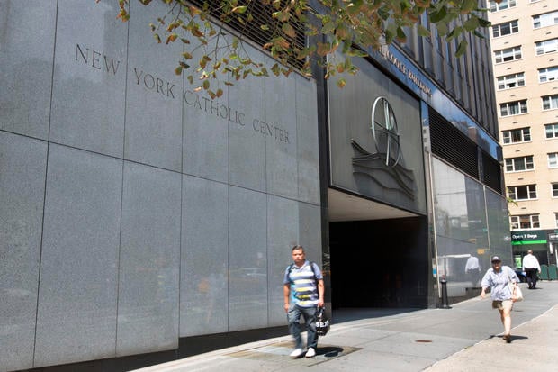 People pass the Archdiocese of New York