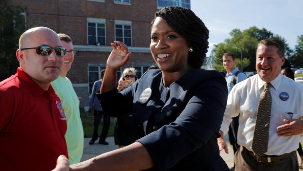Democratic U.S Congressional candidate and Boston City Councilor Ayanna Pressley greets voters outside a polling station in Boston