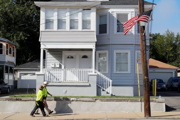 A Columbia Gas of Massachusetts crew works in a neighborhood evacuated following a series of gas explosions in Lawrence