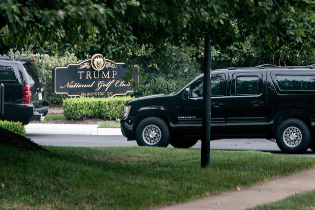 An armored vehicles arrives with US President Donald Trump at the Trump National Golf Club September 1