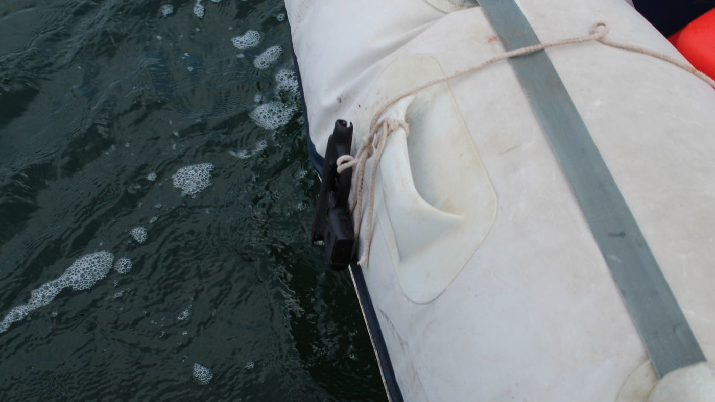 According to law enforcement, the gun was tied to the side of the boat. (Photo source: KMGH-TV)