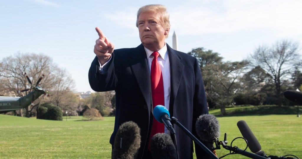 US President Donald Trump speaks to the media prior to departing on Marine One from the South Lawn of the White House in Washington