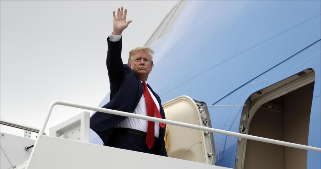 President Donald Trump boards Air Force One for a trip to Florida to tour areas impacted by Hurricane Michael