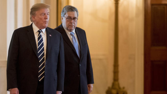 President Donald Trump and Attorney General William Barr arrive for a Public Safety Officer Medal of Valor presentation ceremony in the East Room of the White House in Washington