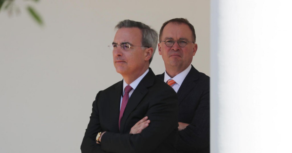 White House Chief of Staff Mick Mulvaney stands with White house counsel Pat Cipollone (L) as First Lady Melania Trump holds an event to celebrate the anniversary of her Be Best childrens initiative in the Rose Garden at the White House in Washington