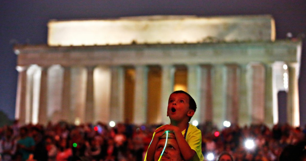 A child reacts as he watches fireworks during the 4th of July Independence Day celebrations at the National Mall in Washington
