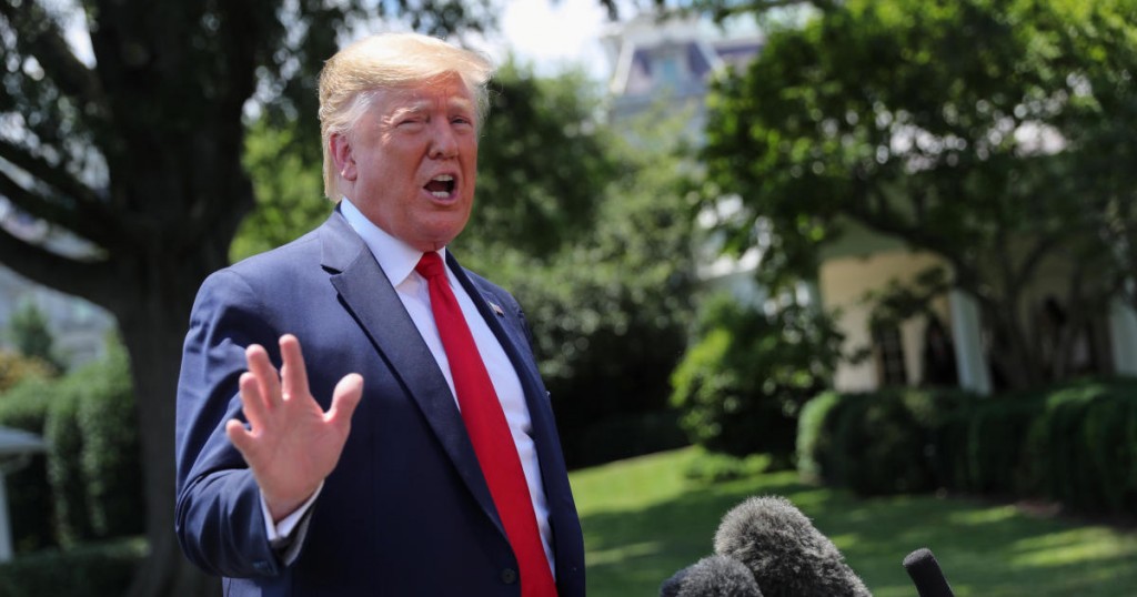 U.S. President Donald Trump talks to reporters as he departs for travel to the G20 Summit in Osaka