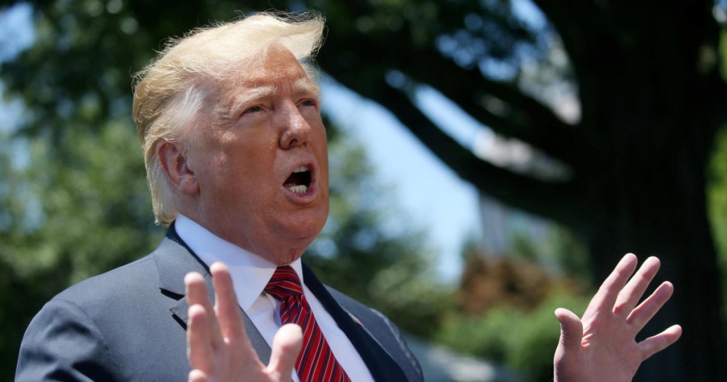 U.S. President Donald Trump speaks to the news media before boarding Marine One to depart for travel to Iowa from the South Lawn of the White House in Washington