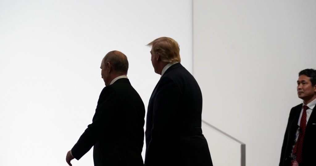 Russia's President Vladimir Putin and U.S. President Donald Trump walk during the G20 leaders summit in Osaka