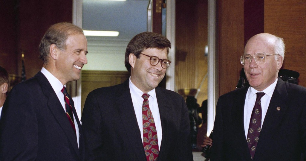 Attorney General nominee William Barr is flanked by Sen. Joseph Biden