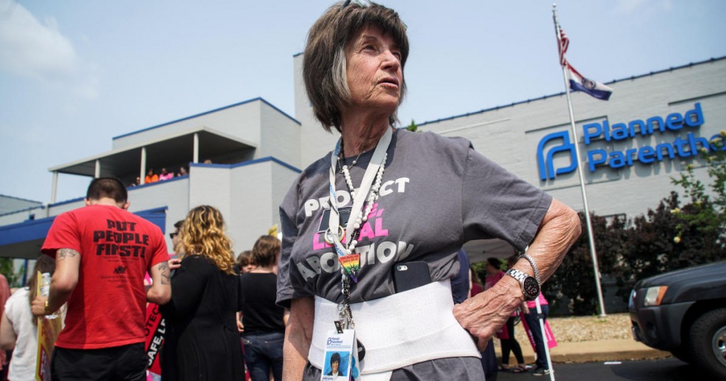 A 20-year employee of Planned Parenthood waits for a rally to start after a judge granted a temporary restraining order on the closing of Missouri's sole remaining Planned Parenthood clinic in St. Louis