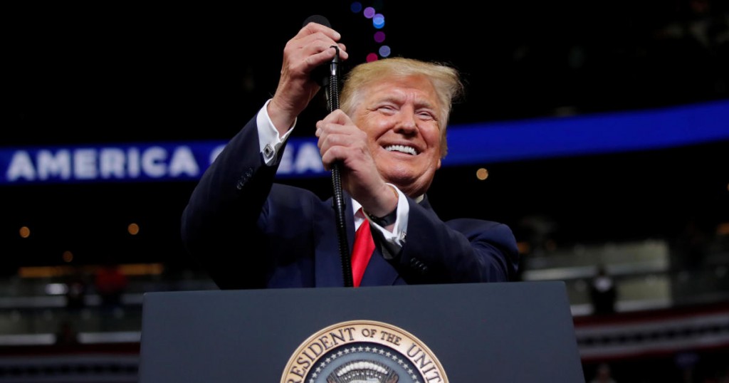 U.S. President Donald Trump reacts on stage formally kicking off his re-election bid with a campaign rally in Orlando