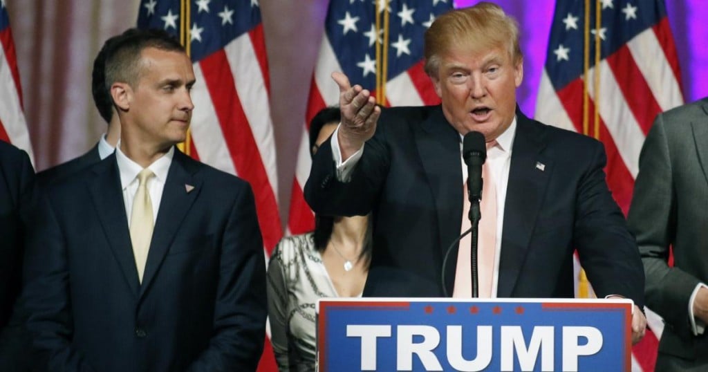 Campaign manager Corey Lewandowski (L) stands next to Republican U.S. presidential candidate Donald Trump  during a news conference in Palm Beach