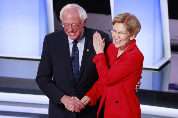 U.S. Senator Bernie Sanders and U.S. Senator Elizabeth Warren shake hands before the start of the first night of the second 2020 Democratic U.S. presidential debate in Detroit