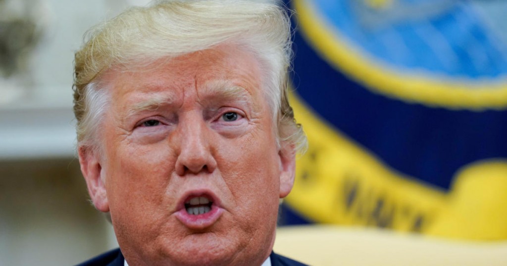 U.S. President Donald Trump answers questions from reporters as he meets with Romania's President Klaus Iohannis in the Oval Office of the White House In Washington