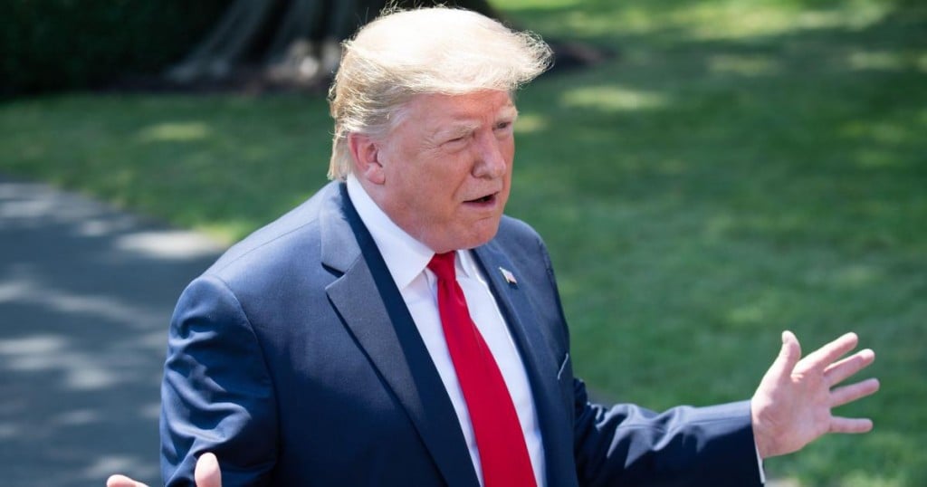 US President Donald Trump speaks to the media after arriving on the South Lawn of the White House in Washington