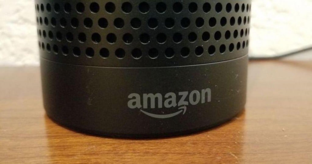 Close-up of the base of an Amazon Echo smart speaker using the Alexa service