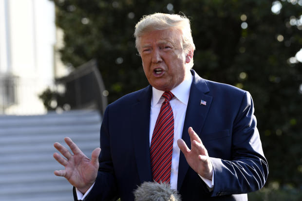 President Donald Trump talks with reporters before leaving on Marine One on the South Lawn of the White House in Washington