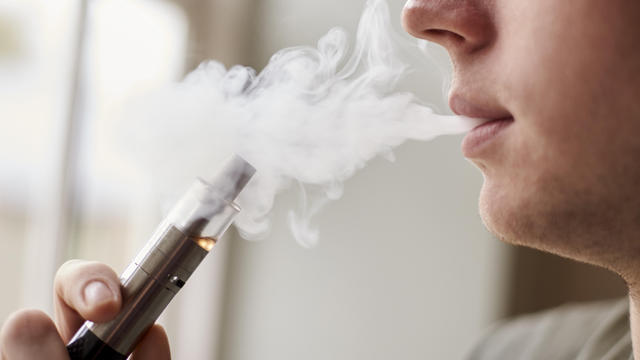 Close Up Of Man Vaping As Smoking Alternative 