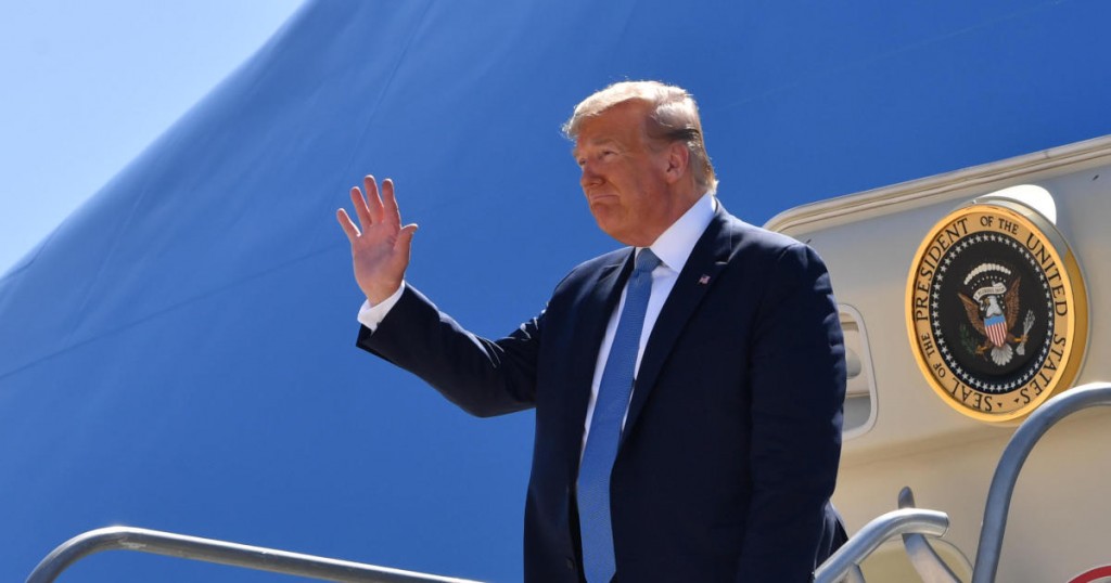 US President Donald Trump waves as he exits Marine One after landing at San Diego International Airport in San Diego