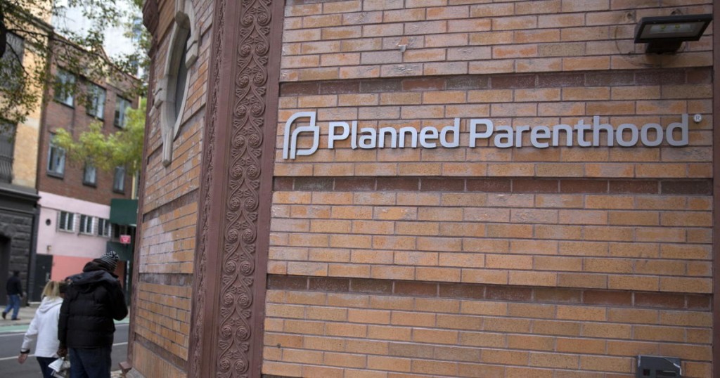 People walk past a Planned Parenthood clinic in the Manhattan borough of New York