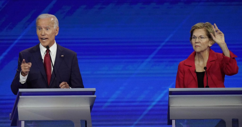 Democratic presidential candidate former Vice President Joe Biden answers a question as Sen. Elizabeth Warren