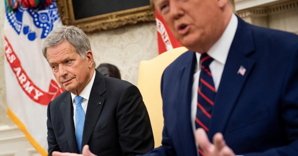 US President Donald Trump speaks to the press as he meets with Finland's President Sauli Niinisto  (L) in the Oval Office of the White House on October 2