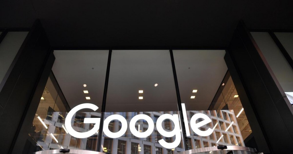 A logo is pictured above the entrance to the offices of Google in London on January 18