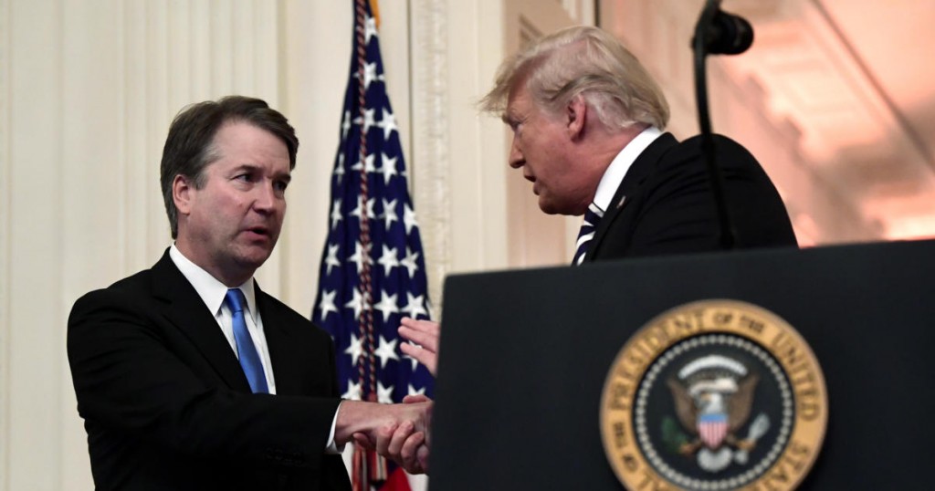 President Donald Trump shakes hands with Supreme Court Justice Brett Kavanaugh