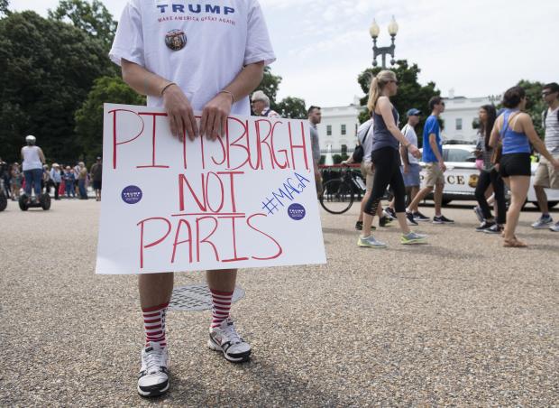 Supporters of US President Donald Trump and his policies demonstrate during a "Pittsburgh Not Paris" rally in support of his decision to withdraw the US from the Paris Climate Accord