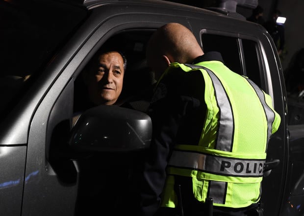 A driver is questioned at a LAPD police DUI checkpoint in Reseda