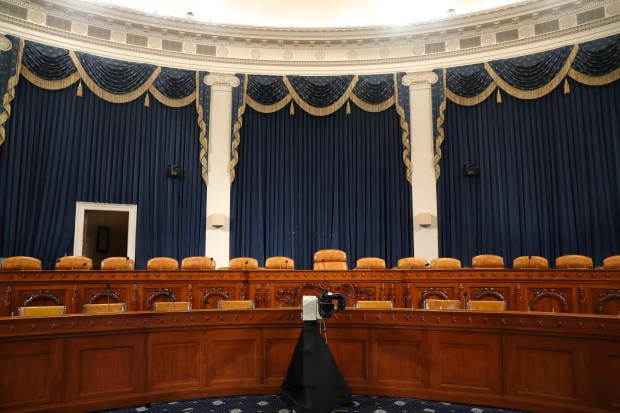 The dais in the hearing room where the House will begin public impeachment inquiry hearings Wednesday
