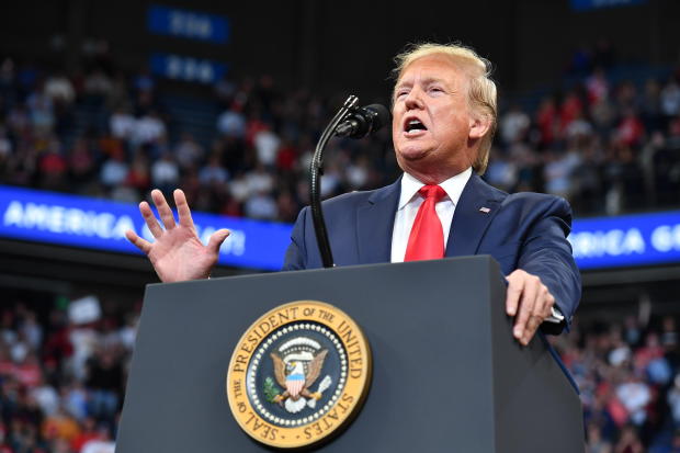 US President Donald Trump gestures as he speaks during a rally at Rupp Arena in Lexington