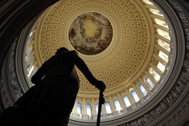 A statue of President George Washington stands in the U.S. Capitol Rotunda