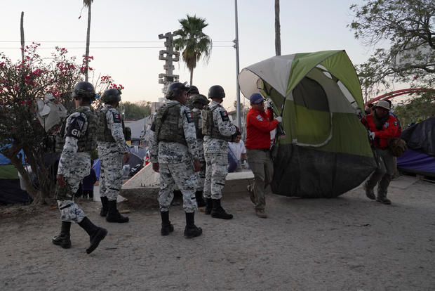 Asylum seekers' tents are relocated near the banks of the Rio Grande in Matamoros 