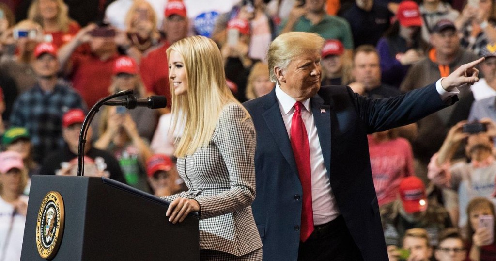 US President Donald Trump gestures as his daughter Ivanka Trump speaks at a Make America Great Again rally in Cleveland