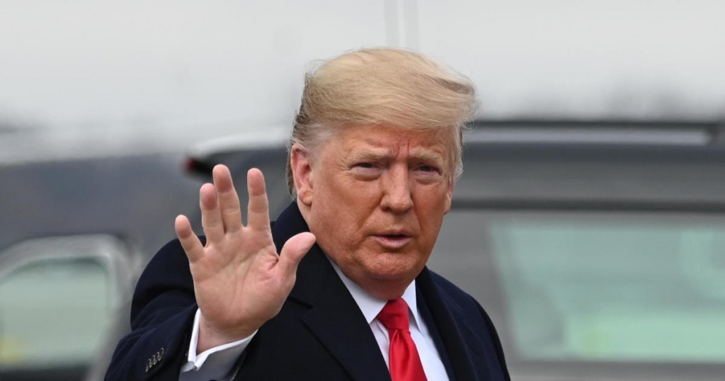 US President Donald Trump arrives to board Air Force One as he departs Joint base Andrews in Maryland on December 14