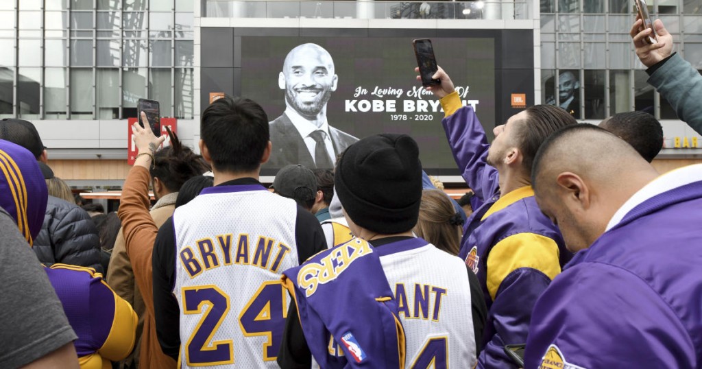 People gather outside Staples Center after the death of Laker legend Kobe Bryant