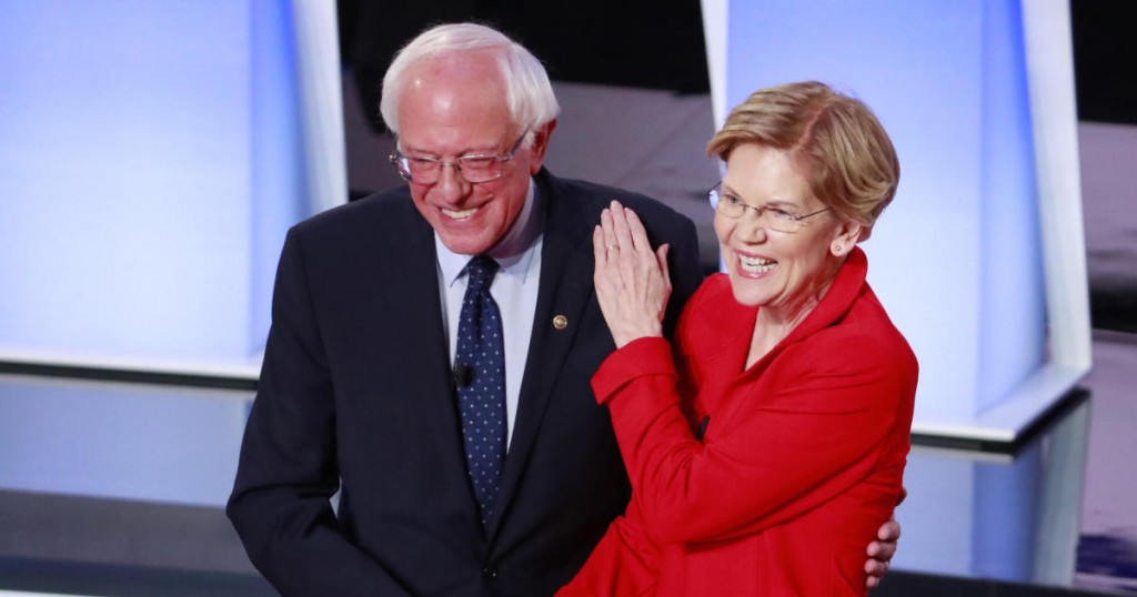 U.S. Senator Bernie Sanders and U.S. Senator Elizabeth Warren shake hands before the start of the first night of the second 2020 Democratic U.S. presidential debate in Detroit